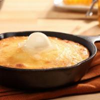 Skillet Corn Bread With Honey Butter · Fresh baked and topped with honey butter.
