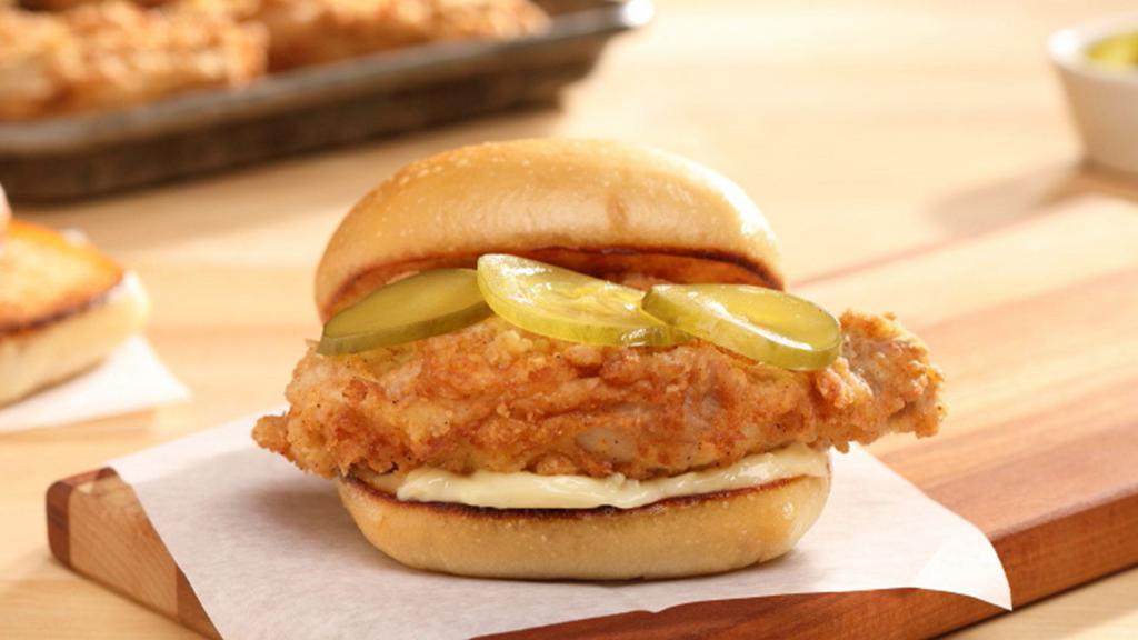Fried Chicken Sandwich · Country fried chicken with pickle and mayonnaise on a buttered bun.