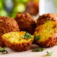 Falafel · Mix of golden fried beans and garbanzo with garlic, onions, herbs and spices. Comes with let...