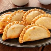 Spinach Cheese Empanada · Delicious and fresh chopped spinach, brown onion, mozzarella, ricotta, mascarpone, parmesan ...