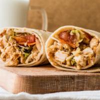 Chicken Shawarma Sandwich · Thinly carved marinated chicken, lettuce, tomatoes and garlic sauce on large pita.