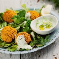 Veggie Falafel Salad · A mix of lettuce, tomatoes, onions, parsley topped with veggie vegan falafel, Mediterranean ...