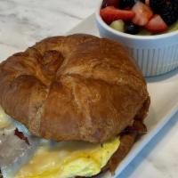 Breakfast Croissant · scrambled eggs, pecan smoked bacon and white cheddar on a fresh croissant, served with fresh...