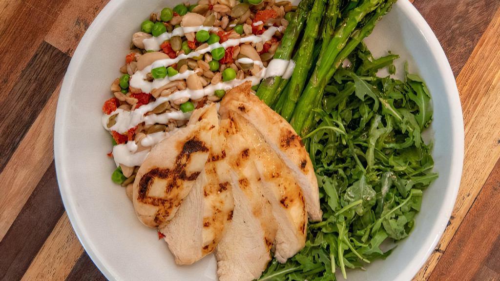 Farro Protein Bowl · grilled sous vide chicken breast, farro, arugula, cannellini beans, roasted tomatoes, pepitas, seasonal vegetable and a goat cheese vinaigrette