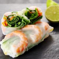 Shrimp Rolls · Deep fried shrimp wrapped in egg roll skin served with sweet and sour sauce.