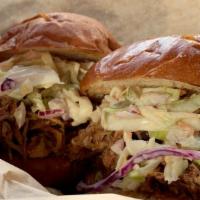 Sliders · Pulled pork topped with slaw on two brioche slider buns. Need BBQ sauce? Add it as an extra.