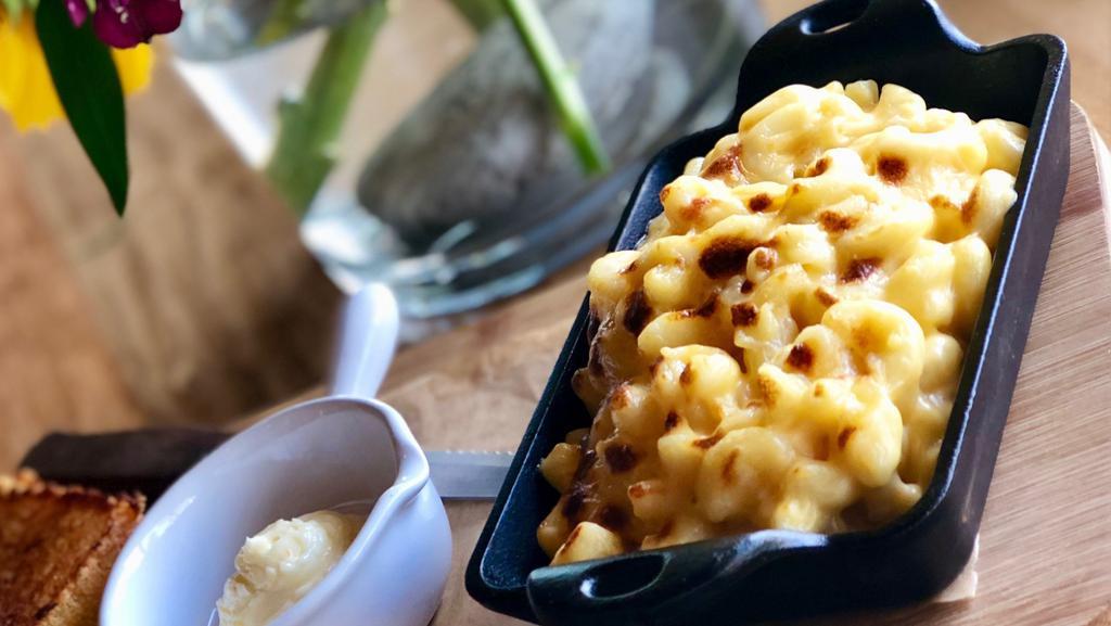 Fritos-Crusted Mac 'N Cheese · Crumbled Fritos and cheese on top of house mac 'n cheese.