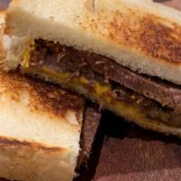 Grilled Brandt Beef Brisket & Cheese · Dry rub smoked brisket, cheddar, sourdough bread. Served with chips.