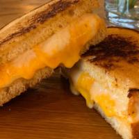 Grilled Cheese & Tomato · Cheddar, swiss, tomato, sourdough. Served with chips.