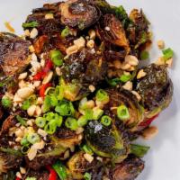Kung Pao Crispy Brussels Sprouts · **New Version Alert** Kung Pao sauce, fresno chilies, roasted peanuts, scallion