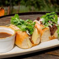 Stone Beef Dip · Slow braised beef, creamy horseradish, gruyere cheese, arugula, oven toasted baguette and au...