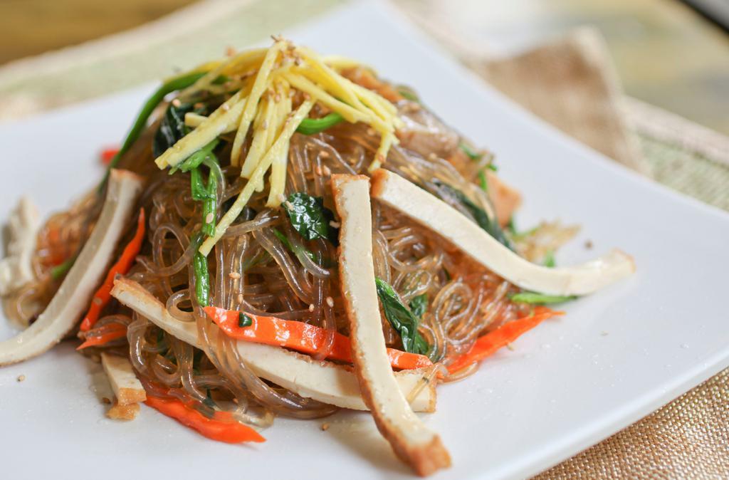 Jap Chae · Pan fried glass noodles with assorted vegetables and tofu cutlet. Served with or without beef.