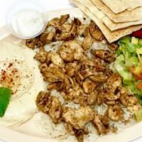 Chicken Shawarma Plate · Chicken breast thinly sliced with tahini or garlic. Kabob and shawarma plates come with humm...