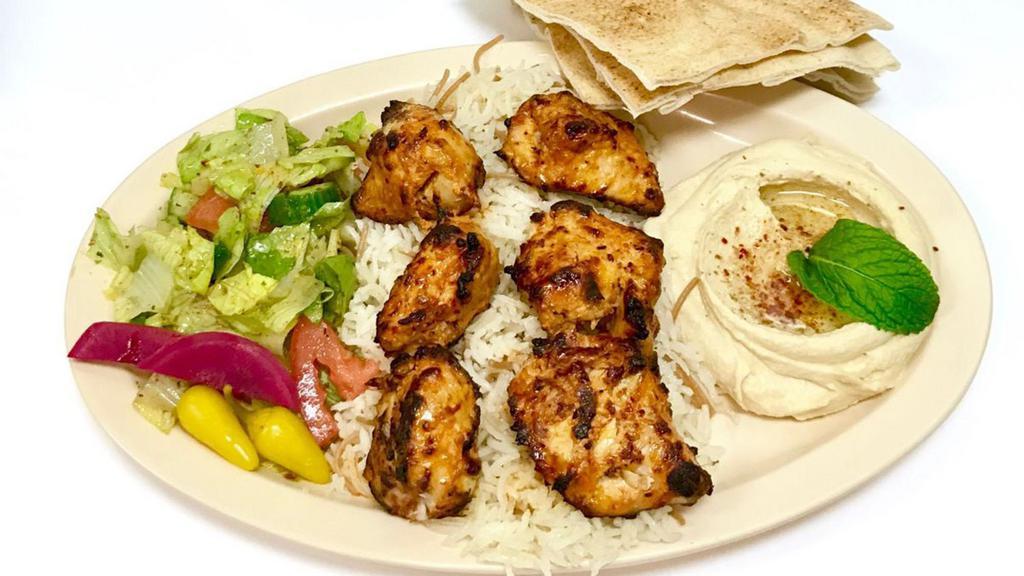 Chicken Shish Kabob Plate · Six pieces of marinated charbroiled chicken breast. Kabob and shawarma plates come with hummus, salad, rice and garlic sauce