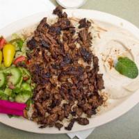 Beef Shawarma Plate · Filet mignon thinly sliced with tahini or garlic. Kabob and shawarma plates come with hummus...