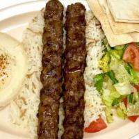 Beef Kafta Lulah Plate · Two skewers of charbroiled ground beef. Kabob and shawarma plates come with hummus, salad, r...