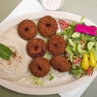 Falafel Plate · Vegetarian. Six pieces of fried smashed garbanzo with garlic and spices served with hummus a...