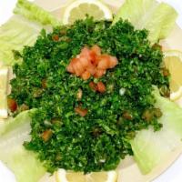 Tabouli Salad · Vegetarian. Parsley, tomatoes, green onions, cracked wheat, mint, olive oil, and lemon.