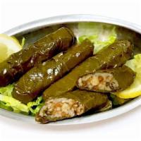 Grape Leaves · Vegetarian. Rolled cooked grape leaves stuffed with rice, garbanzo beans, and vegetables.