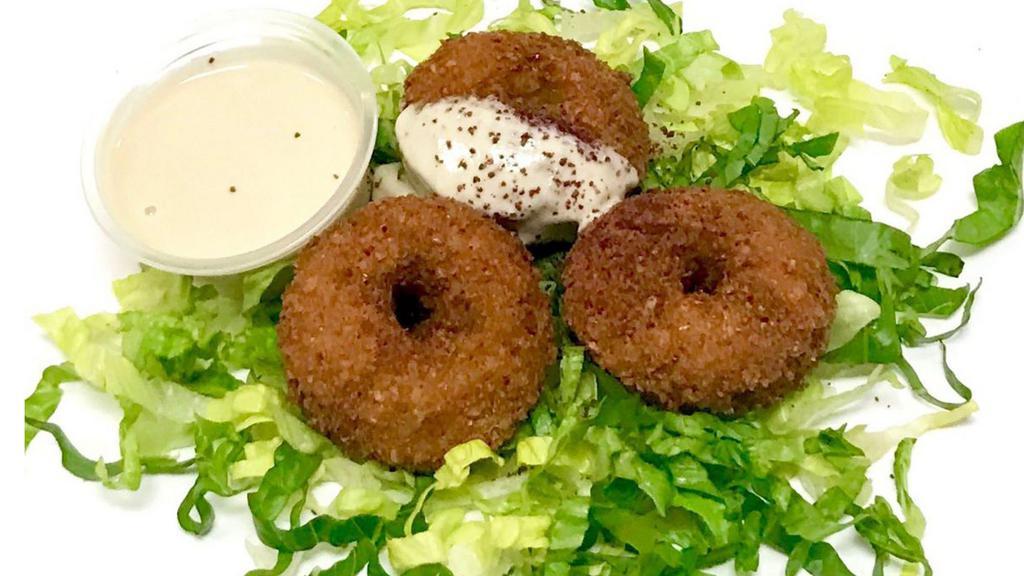 Falafel Order ( 4 Pieces ) · Vegetarian. Fried smashed garbanzo with garlic and spices.