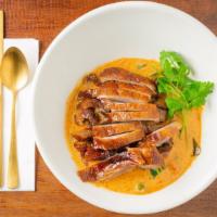 Red Curry · Spicy. Eggplant, bell pepper, sweet thai basil with bamboo shoots simmered in coconut milk a...