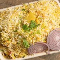 Veggie Dum Biryani · Marinated vegetables cooked with rice and Hyderabadi spices.