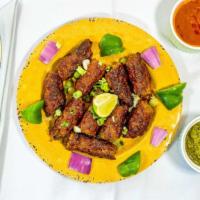 Kandhari Chicken Seekh Kabab · Chicken cooked with onions sauce and sautéed in grill.