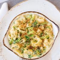 Baked Cheesy Paccheri & Broccoli · fontina cheese sauce, truffle oil, parmesan, chives