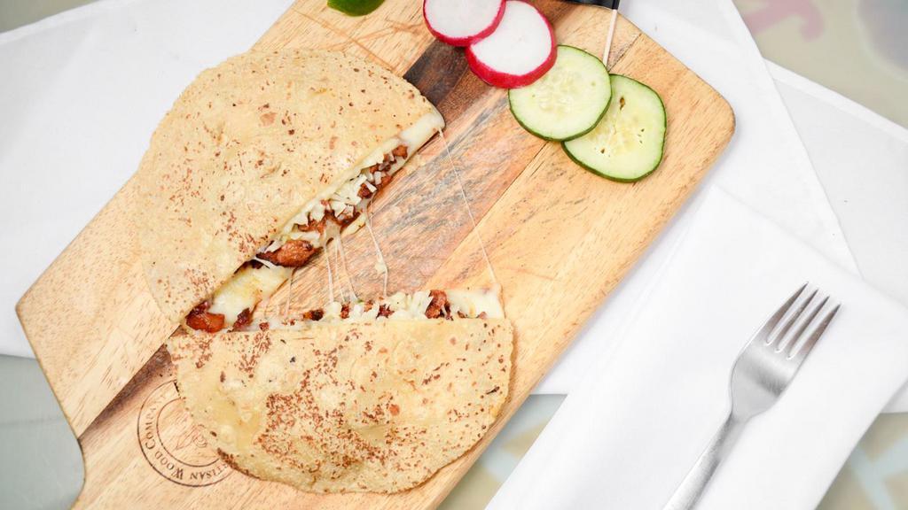 Mulita Pac-Man · Two stacked handmade corn tortillas with Mozzarella cheese, and your choice of meat.