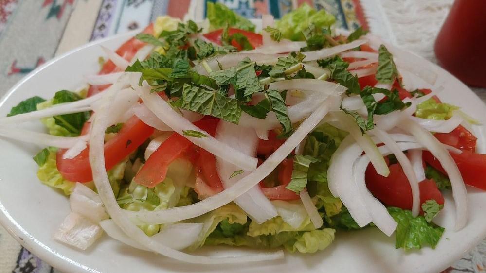Fresh Green Salad · Fresh lettuce, tomato. onions and cilantro seasoned with lemon.