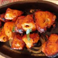 Tandoori Chicken Boti Kabab · (Twelve-pieces) Boneless cubes of chicken marinated in yogurt & spices baked in clay oven.