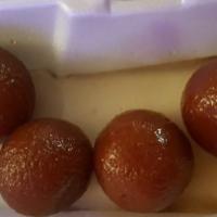 Gulab Jamun (Two Pieces) · Deep fried dough served in sugar syrup flavored with rose water.