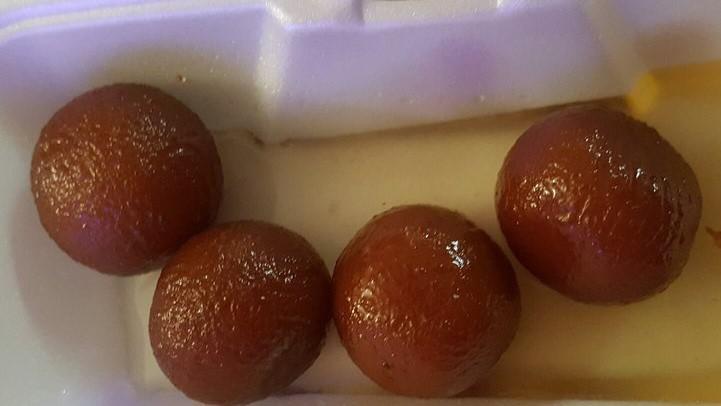 Gulab Jamun (Two Pieces) · Deep fried dough served in sugar syrup flavored with rose water.