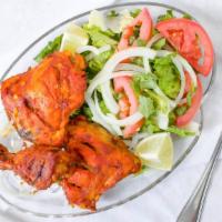 Tandoori Chicken Leg Platter · Piece of chicken tandoori leg served with basmati rice & fresh salad.