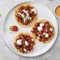 Carne Asada Taco · Grilled sirloin steak topped with sour cream, salsa, and cilantro.