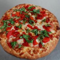 Tuscan Pizza · Roasted pepper, roasted garlic, sun-dried and Roma tomato and fresh basil.