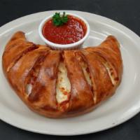 Deluxe Calzone · Pepperoni, sausage, mushroom, onions, bell peppers, olives, tomato sauce, ricotta and mozzar...