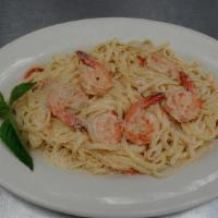 Garlic Shrimp Linguini · Large shrimp, tomato, olive oil, garlic, Parmesan, wine and cream sauce.