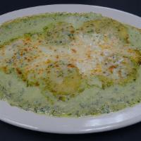 Spinach Pesto Ravioli · Pesto cream sauce and mozzarella cheese.