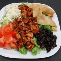 Bbq Chicken Salad · Grilled marinated chicken breast in lime southwest dressing, romaine lettuce,black beans, to...