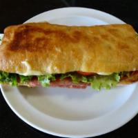 Turkey Sandwich · Sliced turkey, lettuce, tomato, mozzarella cheese and mayonnaise on ciabatta bread.