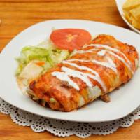De Carne Asada Burrito · Carne asada.  Served with salad and a touch of sour cream and guacamole.