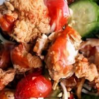 Crispy Chicken Cobb Salad · Shredded romaine, crispy chicken, bacon, tomatoes, avocado, hard boiled egg, blue cheese, to...