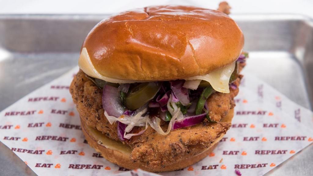 Shaq Attack · Spicy. Pepper jack cheese, jalapeño slaw, and spicy chipotle BBQ sauce.