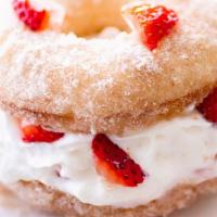 Strawberry Heart Attack  · Fresh Donut filled with whipping cream and fresh strawberry coating powder sugar on top.