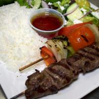 Steak Kabob · Charbroiled and marinated beef. Served with two sides, pita bread and a veggie skewer.