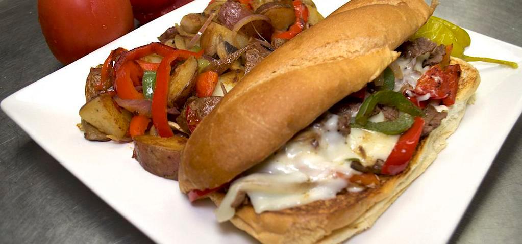 Philly Cheese Steak · Thinly sliced rib-eye steak, sautéed mushrooms, onions, bell peppers, and mayo served on a French roll.