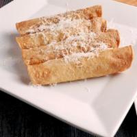 Chicken Taquitos · Four hand rolled Taquitos stuffed with, seasoned chicken and Cheddar cheese wrapped in a cri...