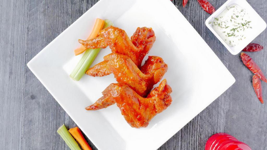 Wing Appetizer · Three golden-fried whole wings, tossed in. one of our 14 signature house made sauces, or naked. Served with celery, carrots.