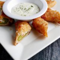 Jalapeno Poppers · Five hand breaded Jalapeños stuffed with. cream cheese, cheddar Cheese, and bacon.